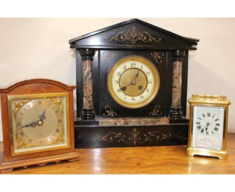 A black slate clock with key, enamel dial, wood cased Elliott clock with gilt cherub detailing; together with a French carria