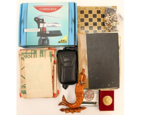 A Chess set with cast metal men, a boxed cork screw set, wooden cocktail set, playing cards, roll up cigarette machine, two h