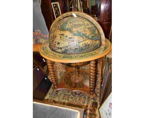 A table globe drinks cabinet, paper coloured globe, on four casters with barley twist legs