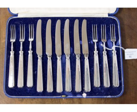 A cased Mappin and Webb dessert knife and fork set, with silver handles, Sheffield 1938 