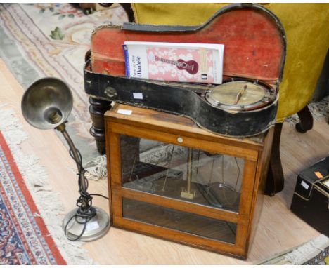 A cased banjo mandolin; together with a cased set of Griffin and George balance scales and a desk lamp (3) 