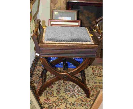 An Edwardian adjustable piano stool, the hinged seat enclosing a manuscript storage section