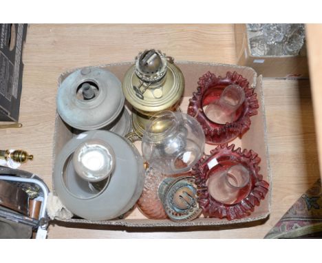 A box of late Victorian oil lamp parts, including Cranberry glass shades 