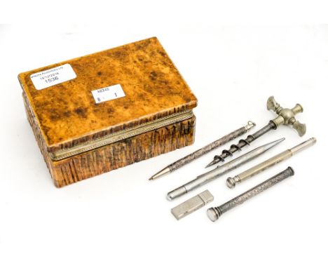 A hardstone trinket box containing two silver pencils, a corkscrew and two white metal pencils 