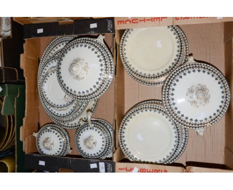 A comprehensive dinner service to include tureens, meat plates, graduated sauce tureens and stands and one ladle (two boxes) 