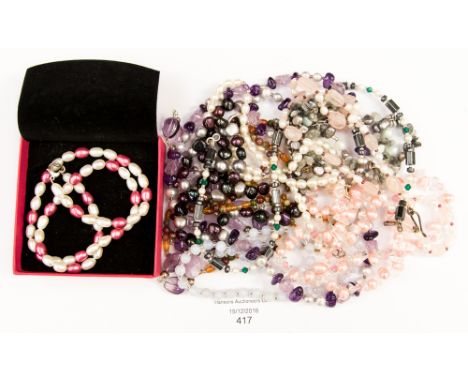 Eleven assorted bead necklaces to include amethyst rock crystal, rose quartz, pearls, etc 