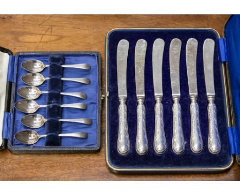 A cased set of six silver egg spoons, Birmingham 1925, approx 1 ozt; a cased set of six silver handled tea knives, hallmark S