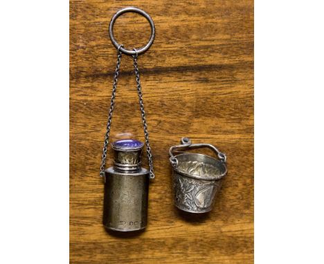 A George V enamel top silver scent bottle on chain, 0.52 ozt; a Victorian silver novelty bucket, Birmingham 1892, 0.23 ozt ap