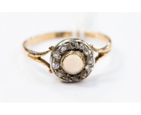 An opal and diamond round cluster 18ct yellow gold ring, 2.2 grams approx, ring size P½ 