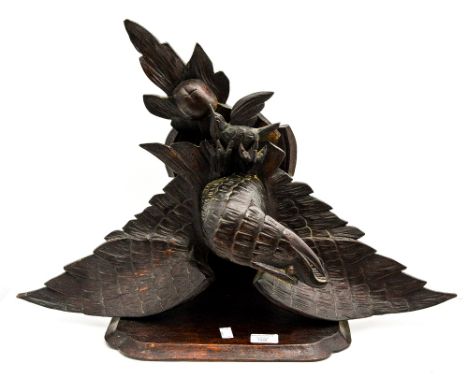 A Black Forest style wall bracket, shelf suspended above a flying Eagle carrying it's prey (1) 