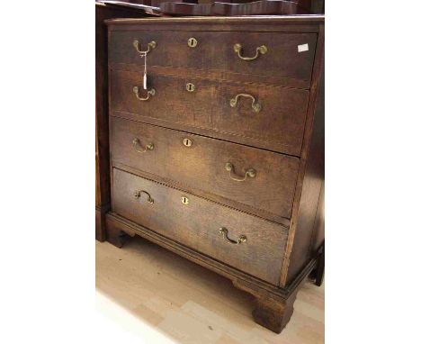 A George III oak chest of drawers, circa 1770, comprising four long graduated drawers, bracket feet 