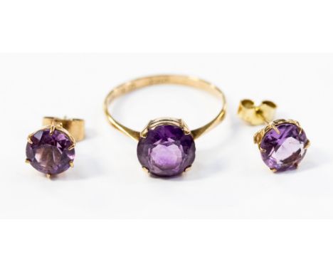 A 9ct gold amethyst single stone ring, ring size O; together with a pair of matching stud earrings, 3.1 grams approx 