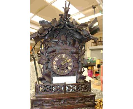 A Black Forest mantle Cuckoo clock, horn numerals and dials, measures 62 cm approx, double wind, with key (1) 