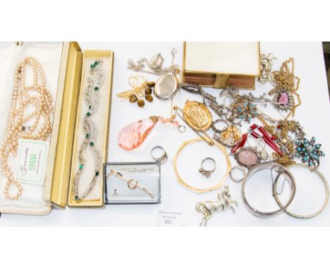 A collection of costume jewellery including silver bangle, siver and quartz brooch, silver locket, ring, various brooches and