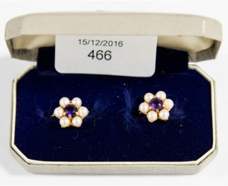 A pair of amethyst and pearl cluster earrings on 9 carat gold, screw fitting