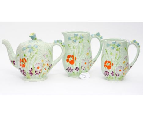 A Beswick wild flower moulded teapot, 870, together with matching graduated jugs 874 -2 and 874 -3 (3)