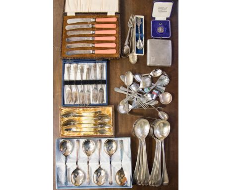 A silver cigarette case; a pair of Georgian silver sugar bows, probably George Wintle, London 1791; silver spoon and fork; si