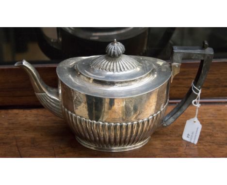 A Victorian silver teapot, Neoclassical boat form, reeded to the lower section, ebony handle and finial, maker Charles Stuart