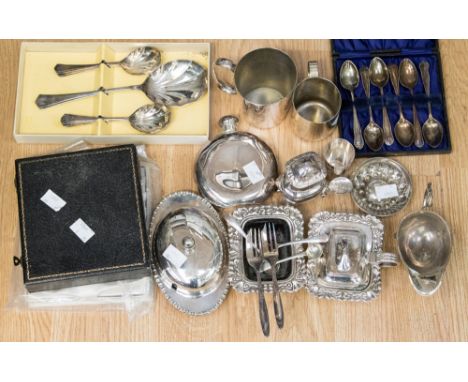 A Sheffield EPNS three piece cruet set, a boxed set of EPNS teaspoon and sugar nips, six butter knives and cake knives, a box