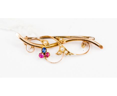 A 15ct gold Edwardian spray brooch set with a small sapphire, ruby and pink tourmaline and seed pearls (one seed pearl defici