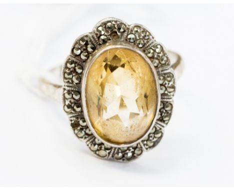 A silver, citrine and marcasite dress ring, stamped silver, ring size R 1/2, gross weight approximately 6.5 grams