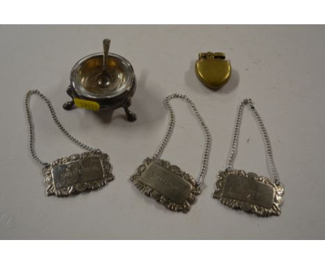 A 19th Century silver salt cellar (marks rubbed); together with three plated decanter labels and a small brass lighter 