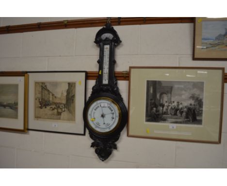 A late 19th Century carved wooden ebonised barometer