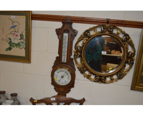 A golden oak aneroid barometer 
