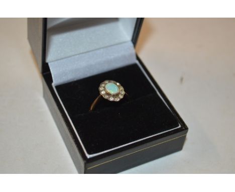 A 9ct gold opal and diamond set ring 