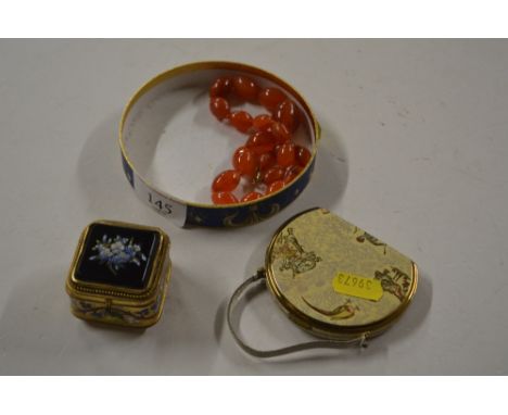A powder compact; together with a hard stone necklace and a gilt metal and enamel decorated trinket box 