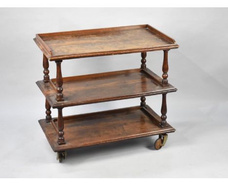 A 19th Century Mahogany Three Tier Buffet, Galleried Back and Turned Supports, on Later Castors 76x44x71cms High