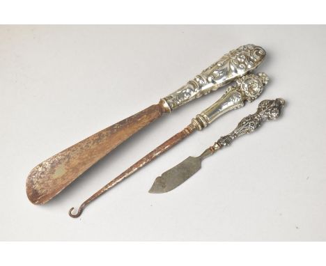 Three Various Silver Handled Ladies Dressing Table Items to comprise Shoe Horn, Button Hook and Cutter