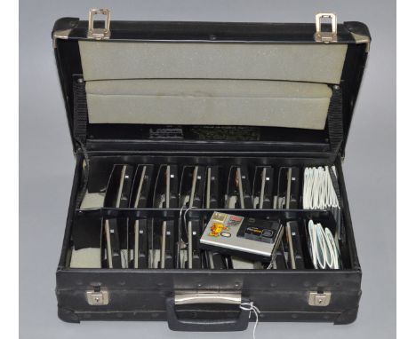 Kodak Disc Camera Sample Case. Fitted suitcase containing 16 Kodak 4000 Disc cameras with instruction books. 12 cameras run w