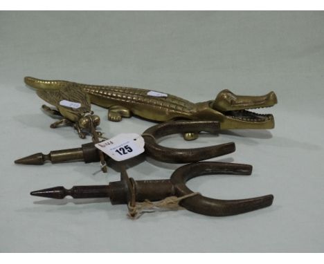 A Cast Brass Fly Match Striker Together With A Crocodile Nut Cracker And Pair Of Brass Boat Rowlocks