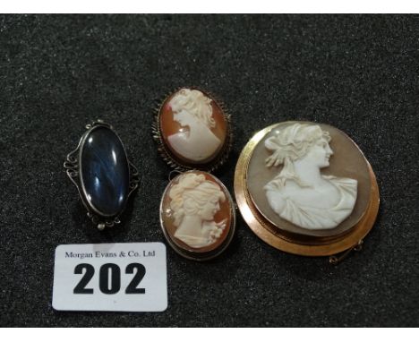 A 9 Carat Gold Framed Shell Cameo Portrait Brooch Together With Two Cameo Pendants And A Silver Framed Brooch