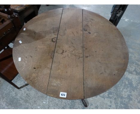 An Antique Oak Circular Topped Tripod Table