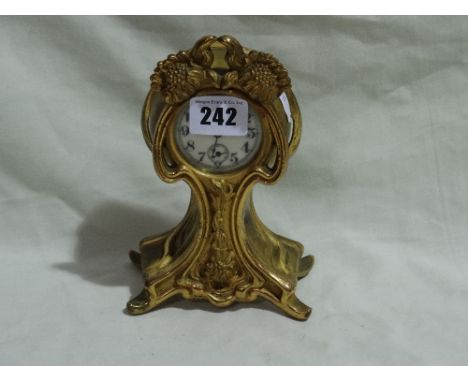 An Art Nouveau Period Gilt Spelter Encased Balloon Mantel Clock With Circular Dial, Waterbury Clock Company
