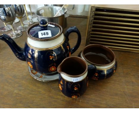 An Early 20th Century Wade Pottery Four Piece Floral Decorated Tea Service