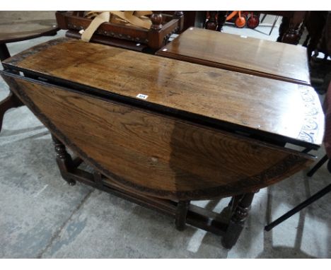 An Antique Oak Gate Leg Table On Block And Turned Stretchers