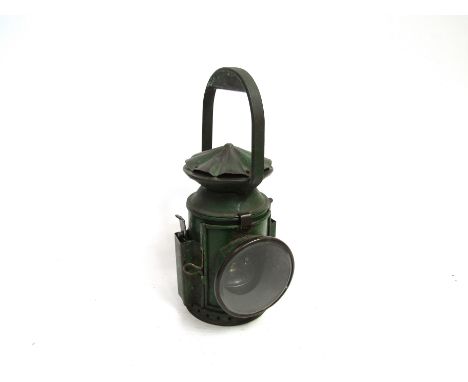 A WWII British railway lamp, original green paint, dated 1940
