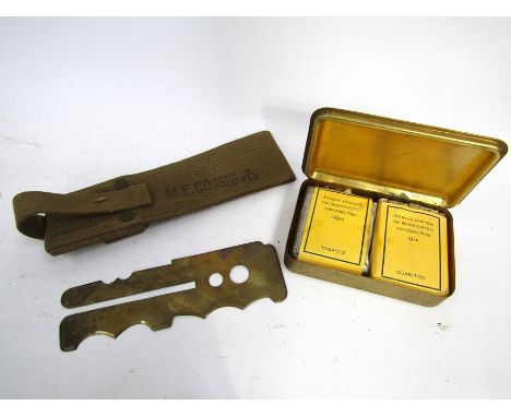 A WWI Princess Mary Christmas 1914 brass cigarette gift box with contents, a brass button polisher and a WWI belt frog (3)