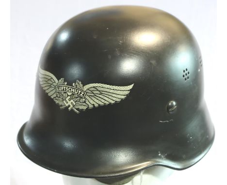 WWII German Luftschutz (Air Raid Police) helmet, re issued after the warwith a new liner. Reproduction Insignia has been appl