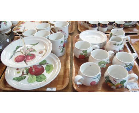 Two trays of Portmeirion pottery 'Pomona' design items to include: two tier cake stand, mugs, saucers and milk jug. (2)(B.P. 