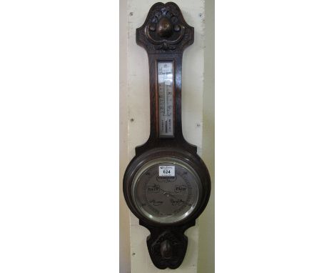 20th Century carved oak wheel barometer. (B.P. 24% incl. VAT)