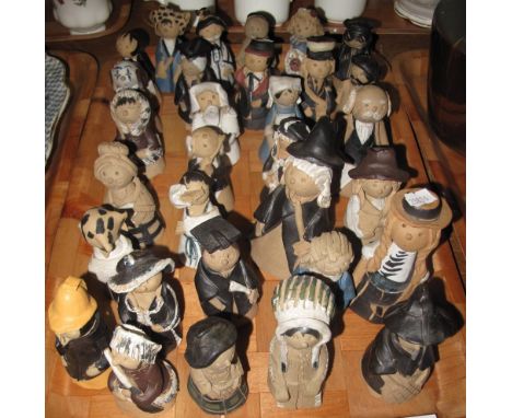 A collection of modern pottery candle snuffers in the form of figures by Don Bennett. (B.P. 24% incl. VAT)