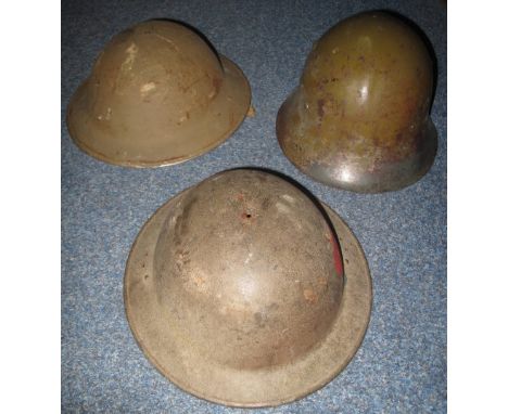 Bulgarian M36 military helmet together with two British army helmets. (3) (B.P. 24% incl. VAT)