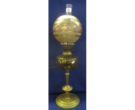 Early 20th Century brass double burner oil lamp with fluted coloured glass reservoir on brass base, glass shade and chimney. 