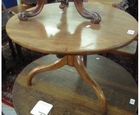 Low mahogany circular tripod occasional table. (B.P. 24% incl. VAT)