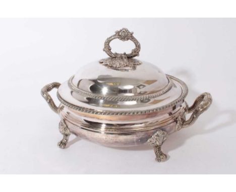 George IV Old Sheffield plate twin handled warming dish and cover of circular form, with gadrooned borders and engraved coat 