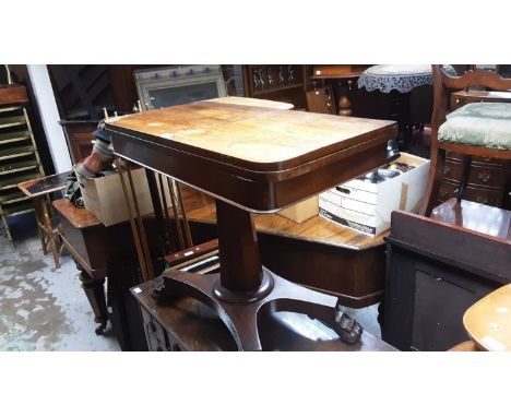 William IV rosewood D-shaped card table, raised on facetted column on platform base and carved paw feet on castors, 91cm wide